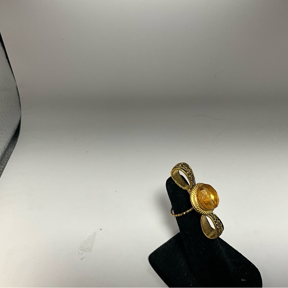 Elegant Gold-Tone Ring with Amber Stone